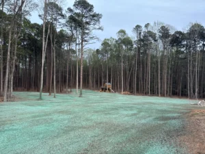 Freshly hydroseeded Bermuda grass erosion control project in North Raleigh, NC before grass growth begins