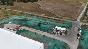 Large-scale hydroseeding project using Bermuda and fescue seed mix at commercial construction site in Greenville NC